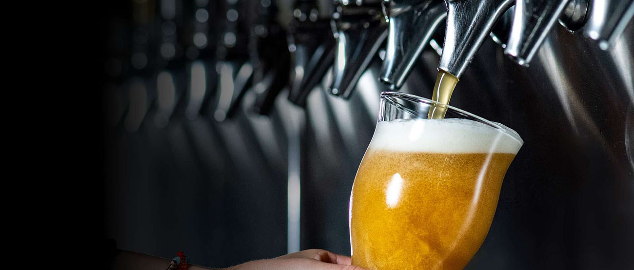 A beer is running out of a tap